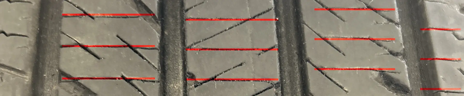 Aftermarket siping added to a tire for improved snow traction.