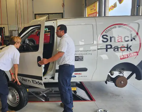 Mitchell Weekend Snack Pack Program inside a Les Schwab service bay
