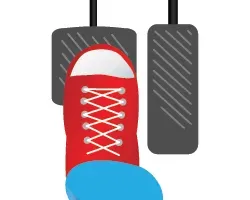 Foot stepping on a brake pedal