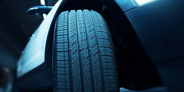 Close up of a front tire on a vehicle.
