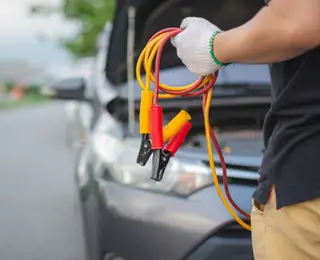 Technician with jumper cables