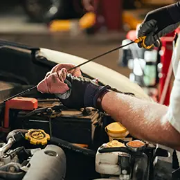 Les Schwab technicians inspecting car