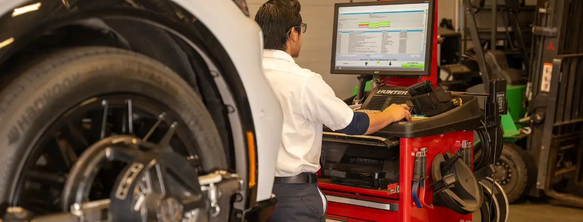Alignment technician performing an alignment